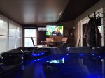 Best feature - screened in porch with a oversized hot tub, gas fire hightop table for 4 and smart tv
